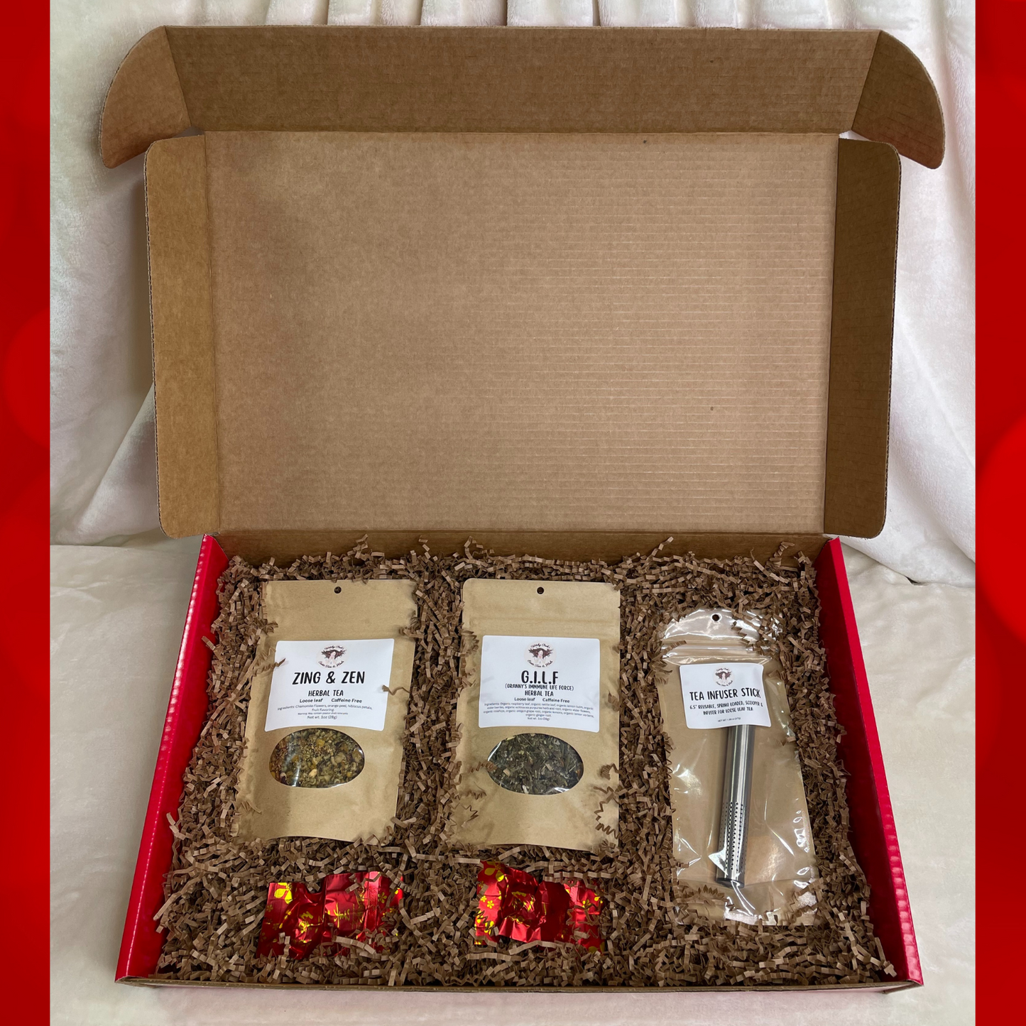 Gift Box Set with 2-1oz Pouches of Tea, A Spring Action Tea Infuser Stick, 2 Blooming Tea Balls in a Large Red Mailer Box